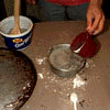 carefully pour the waterinto the sand-starch mixture
